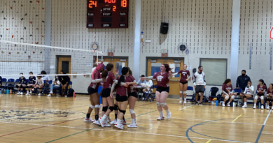 Leonia’s Varsity volleyball team celebrates seconds after their victory against Dwight Englewood School.