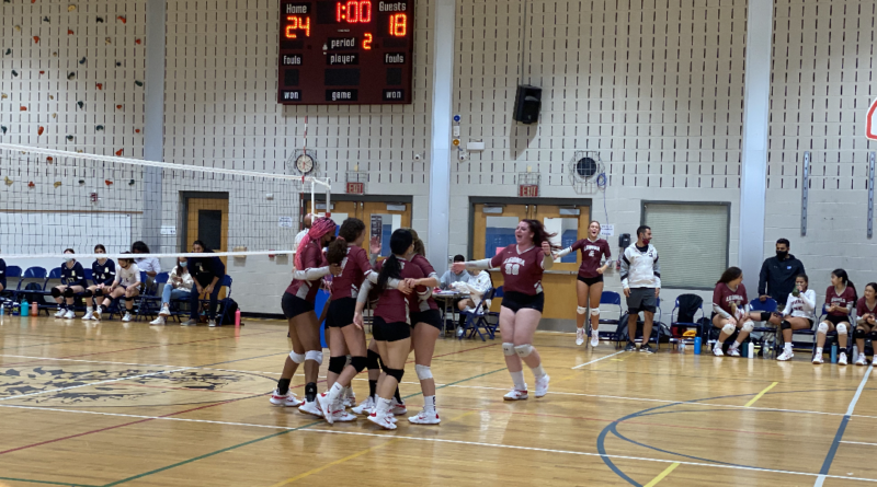 Leonia’s Varsity volleyball team celebrates seconds after their victory against Dwight Englewood School.